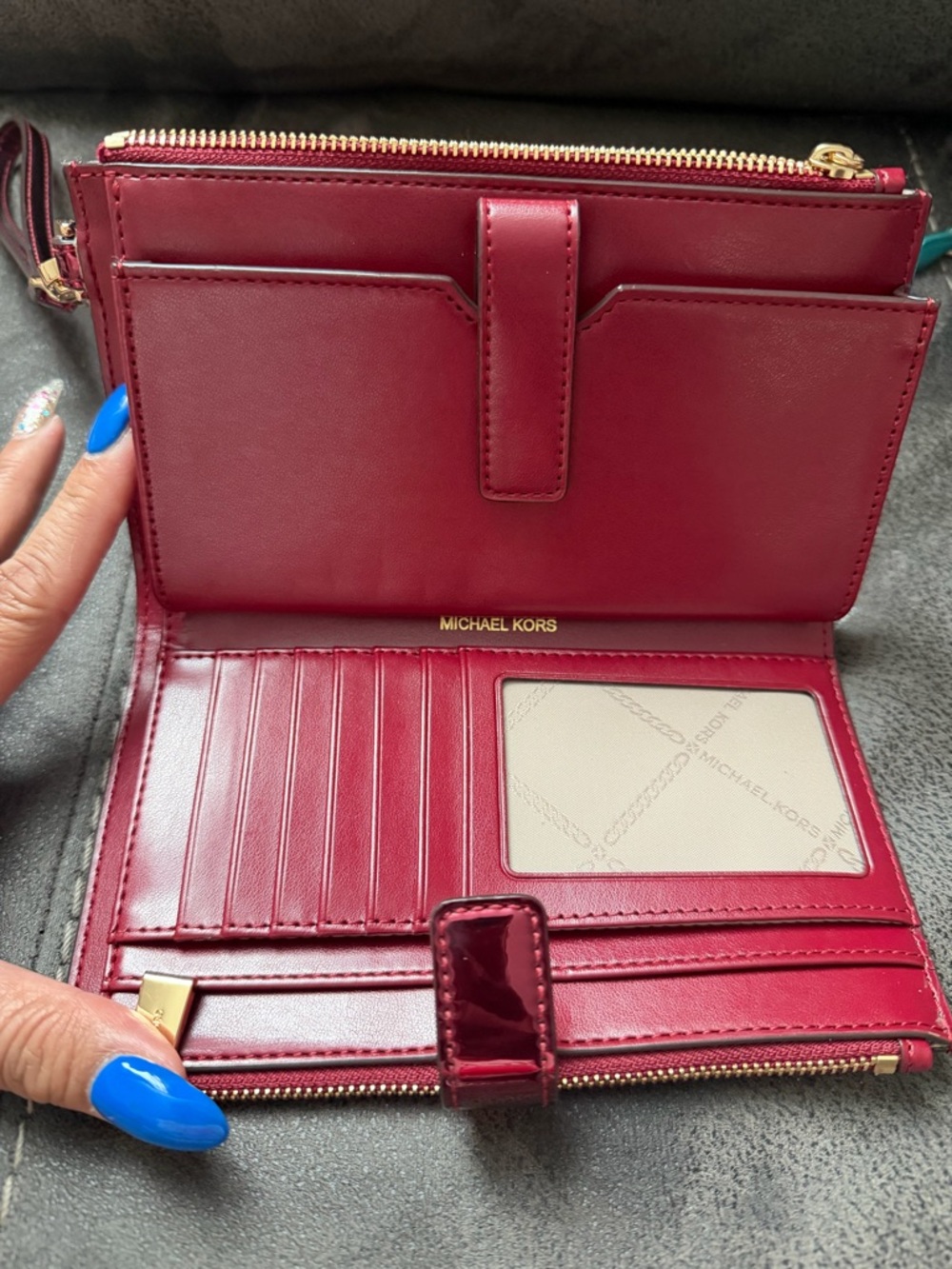 Michael Kors Metallic Fuchsia MK Embossed Wristlet - Picture 2 of 3